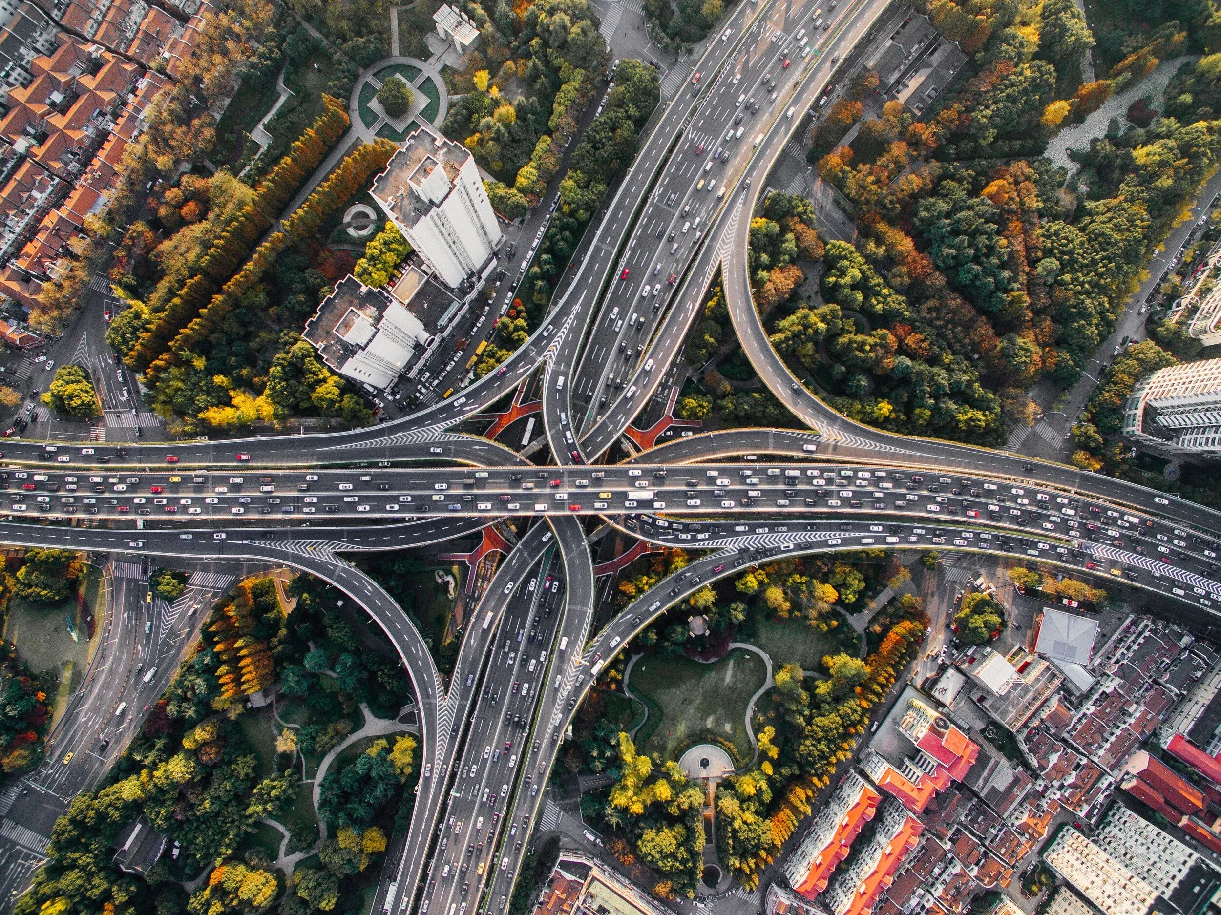 Aerial view of intersecting city roads, representing organic traffic paths